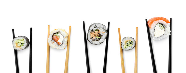Chopsticks with tasty sushi rolls on white background © Pixel-Shot