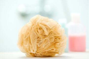 Bath sponge on table in bathroom, closeup