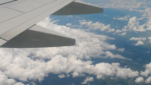 Cargo Airplane Flies In Sky. View From Window On Wing and Earth. International Shipping Concept