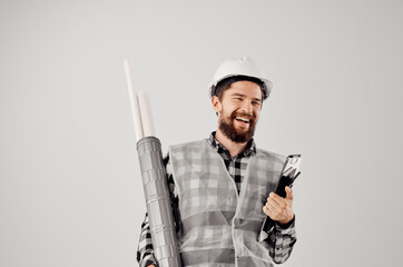 male worker in a white helmet blueprints Professional light background