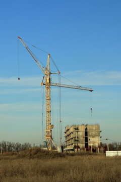 Tower cranes are working on the construction of a new house. Lifting crane.