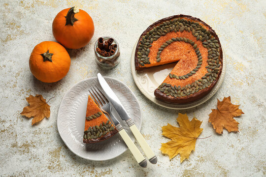 Composition with delicious pumpkin pie on light background