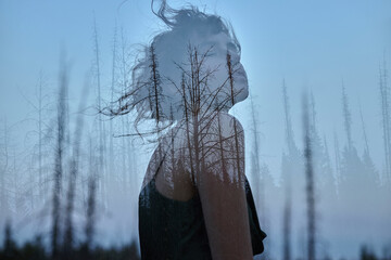 Portrait of a girl with double exposure against a tree crown. Delicate mysterious portrait of a...