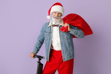 Cool Santa Claus with kick scooter on color background