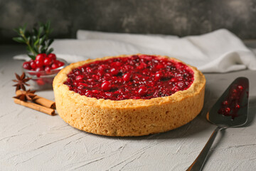 Delicious homemade lingonberry pie and spices on table
