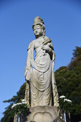 Fototapeta na wymiar Guan yin (Kannon) statue. Kannon is a Buddha who removes people's suffering and listens to their wishes. 