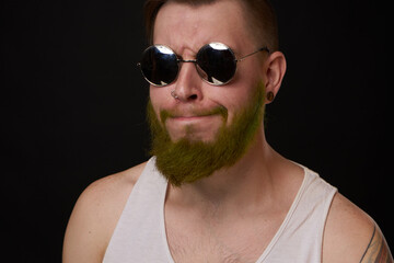 cheerful bearded man in white t-shirt sunglasses posing