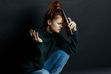 woman with bottle of alcohol smokes a cigarette depression bruises under eyes emotions