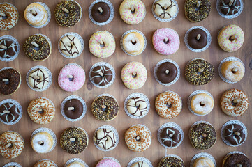 Wooden wall with assorted doughnuts