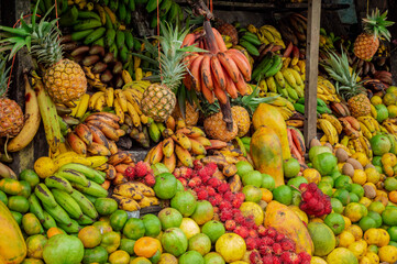 Shelf of many fresh fruits, fresh fruit stall, concept of fruits and healthy food, sale of various fruits