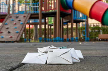 Paper ttakjis on the floor of the playground