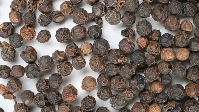 top view HeiHuJiao or Piperis Fructus or Black Pepper Fruit rotating