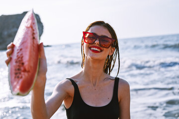 cheerful pretty woman in black swimsuit watermelon fashion travel