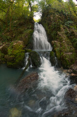 waterfall in the mountains in the forest