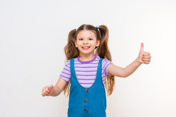 A little emotional and joyful girl on a white isolated background.