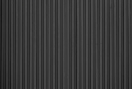 black striped steel wall background and texture.