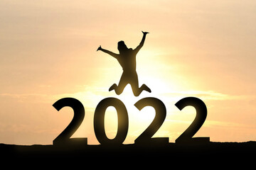 Woman silhouette on 2022 numbers. Happy new year 2022. Celebration concept. Beginning, Happy, enjoy, challenge.