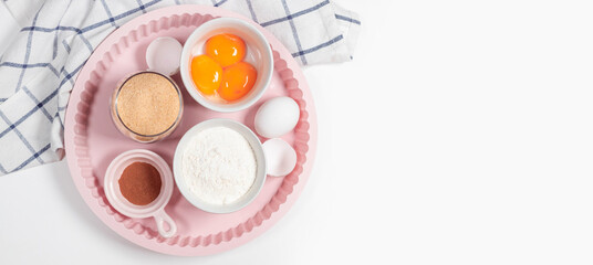 Baking utensils and cooking ingredients for tarts, cookies, dough and pastry. Flat lay with eggs, flour, sugar