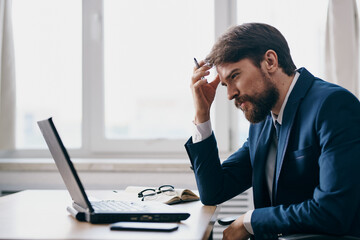 Fototapeta premium businessmen in the office in front of a laptop executive manager