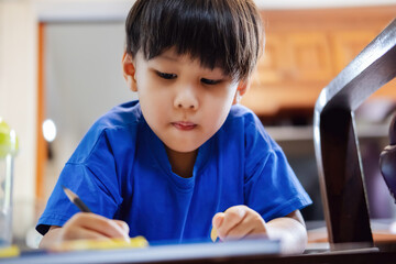 kindergarten children coloring their homework to the teacher.