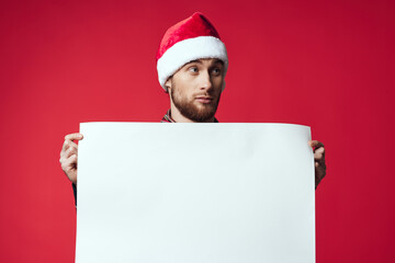 Cheerful man in a christmas white mockup poster studio posing