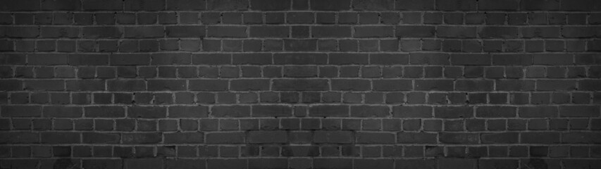 Black anthracite damaged rustic brick wall brickwork stonework masonry texture background banner panorama
