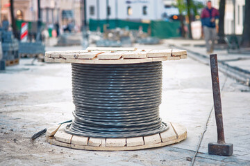 Spool with cable, wire spool - electric city communications, electricity supplying. Wooden coil...