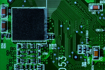 Macro close-up shot of microchip, cpu processor on green high tech electronic printed circuit board...