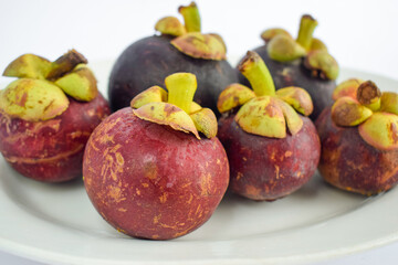 Fresh mangosteen fruit isolated on white background.