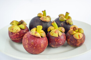 Fresh Mangosteen fruit isolated on white background.