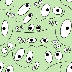 Seamless kids cartoon pattern with eyes on green background 