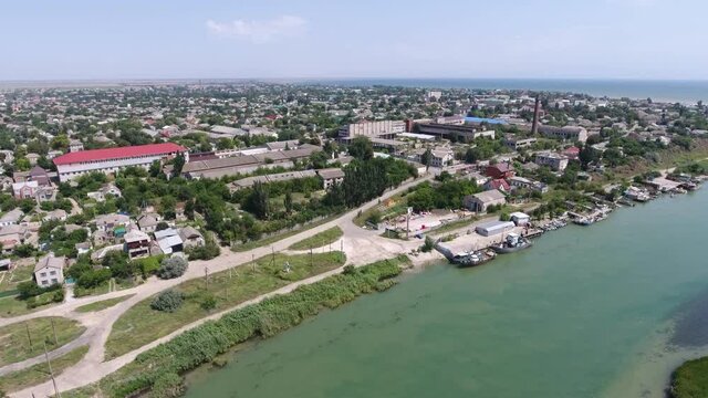 Aerial shot of a large village on Arabat arrow at Black Sea quay in summer