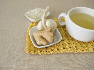 A cup of tea with garlic peel and ginger