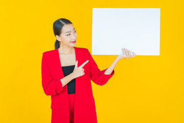 Portrait beautiful young asian woman with empty white billboard