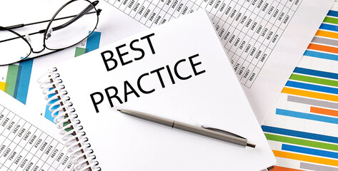 Notebook with text BEST PRACTICE . Diagram and white background,Business concept