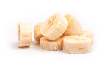 on a white background. peeled banana, cut into pieces. close-up.