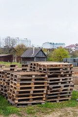 Fototapeta na wymiar Wooden pallets for transporting building materials on a construction site