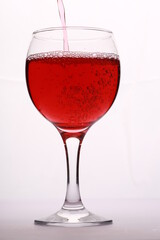 red wine in a glass on a white background