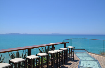 Obraz premium beautiful panorama ocean view at a sunset bar in corfu