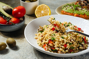 vegetarian and vegan dish bulgur tabbouleh with pepper and herbs