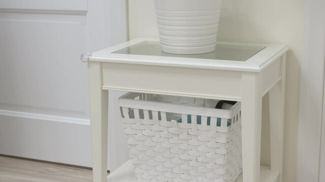 Childproofing a house, child safety devices to protect children at home, baby safety proofing, installing corner guard edge bumper to help prevent injuries from falls against sharp edges of furniture.