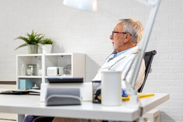 Experiance doctor in ambulance sitting and analyse results of patients