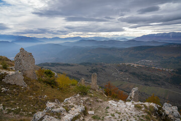 Partial view of ruins of medieval castle in Rocca Calascio and autumn mountains of Abruzzo, Italy