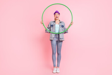 Full length photo of funny blond young lady do excercise wear jeans jacket visor isolated on pink color background