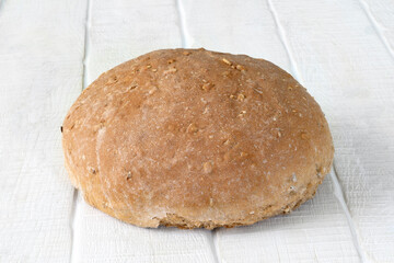 Homemade bread on white rustic wooden table 