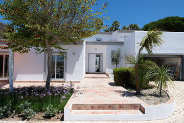 Front of a newly renovated villa painted white