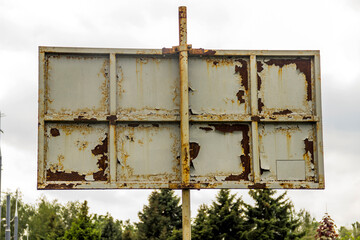 backside of rusty street billboard