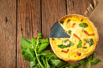 Spinach quiche with onion and bacon.