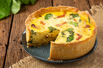 Spinach quiche with onion and bacon.