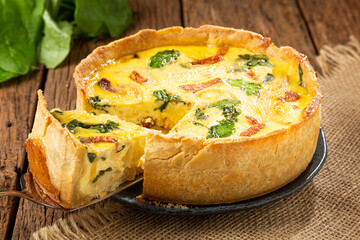 Spinach quiche with onion and bacon.